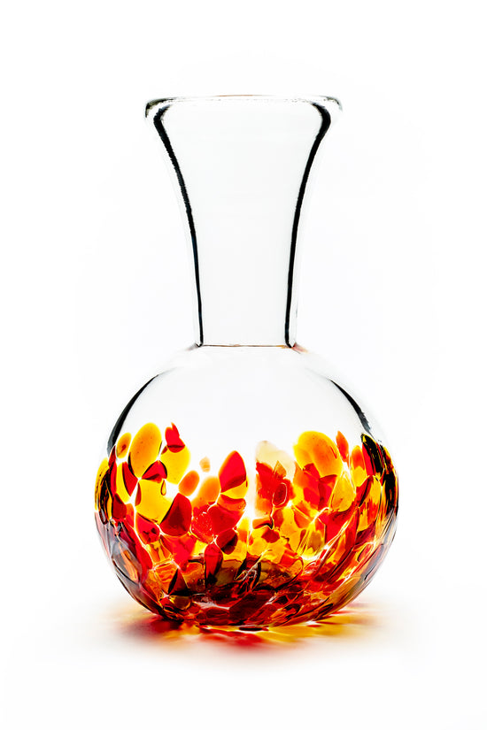 Hand blown glass vase. Red, yellow, and gold glass on the bottom. Colour combination is called "Iris Fire."