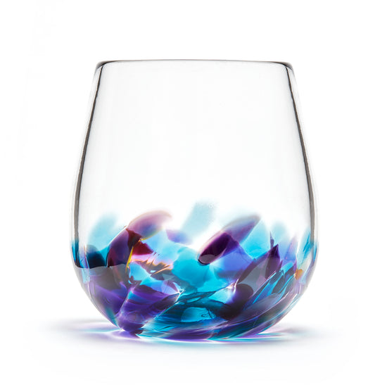 Hand blown glass wine glass. Clear glass with a swirl of teal blue and purple glass on the bottom. Colour combination is called "Amethyst Teal."