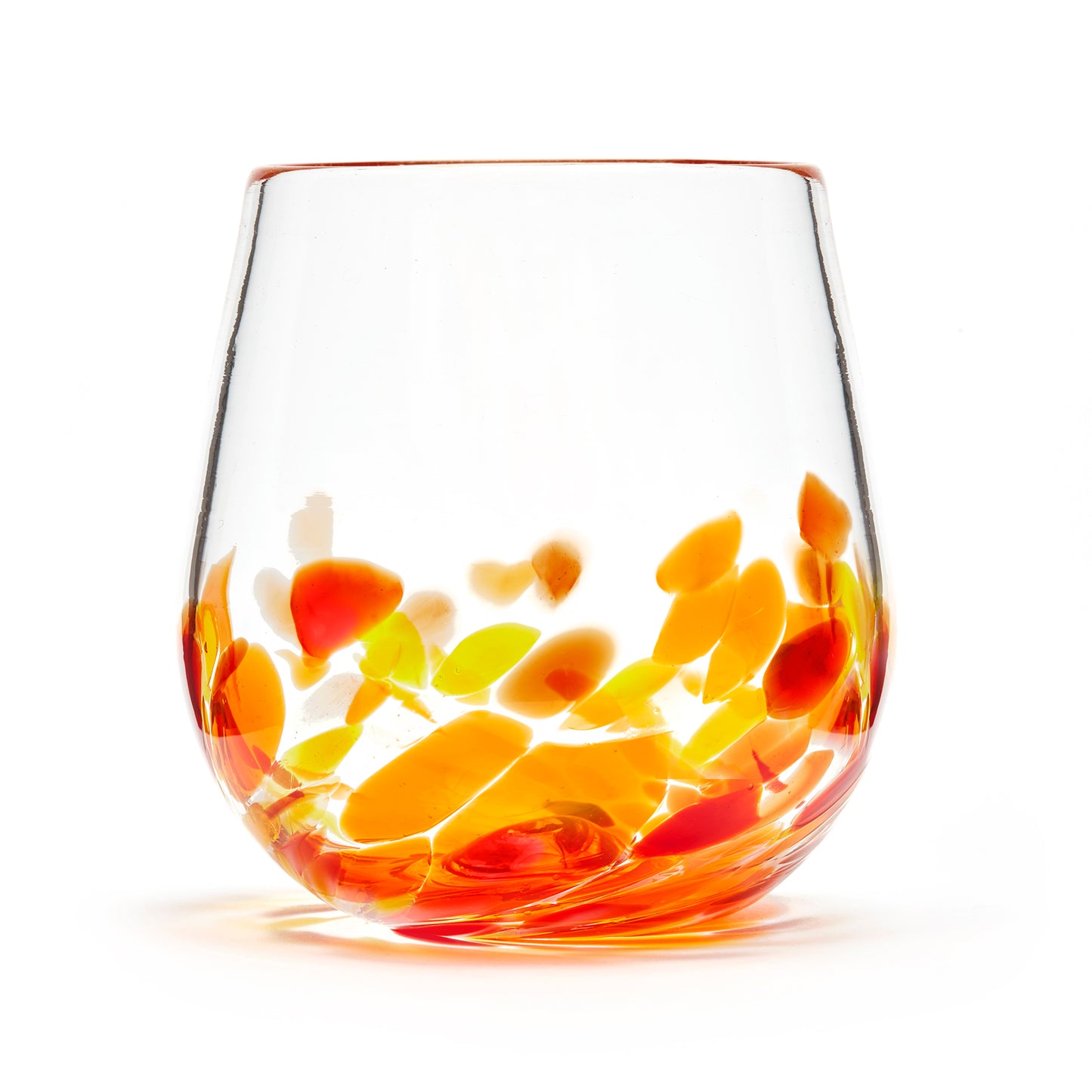 Hand blown glass wine glass. Clear glass with a swirl of red, yellow, and orange glass on the bottom. Colour combination is called "Sunburst."