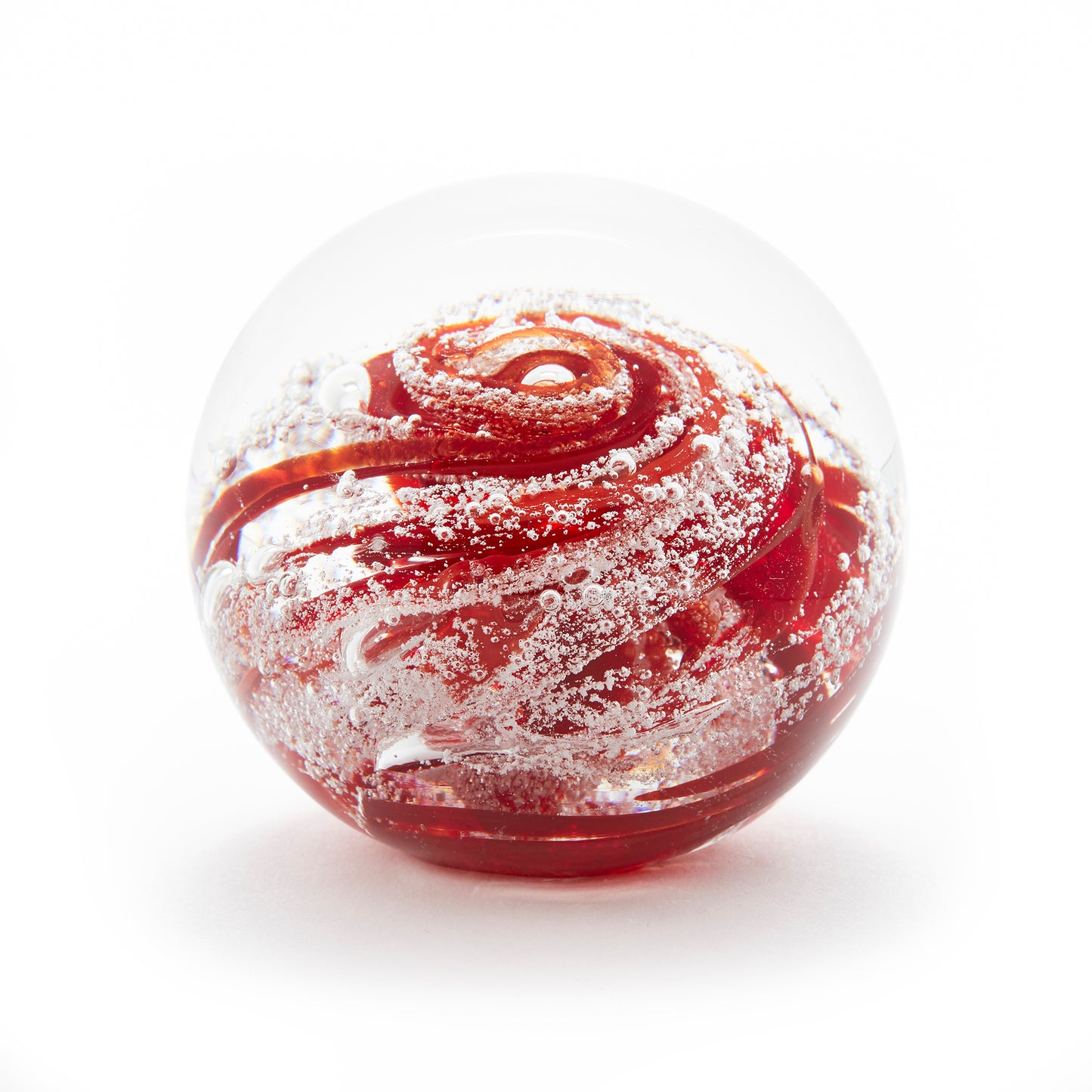 Round memorial glass art paperweight with cremation ash. Ruby red glass.