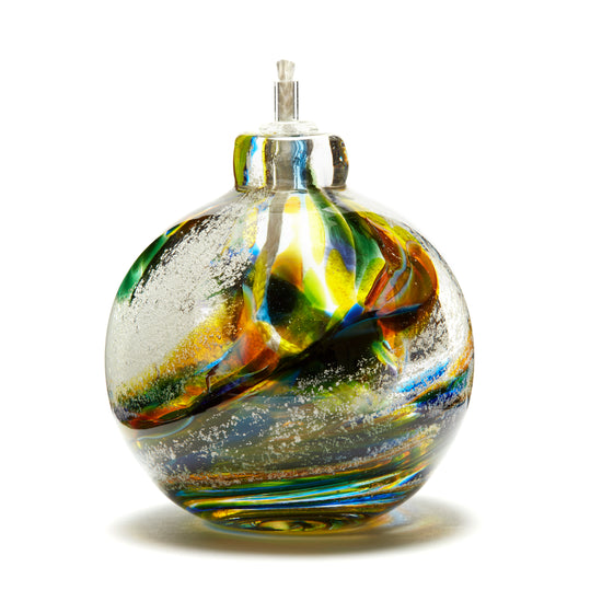 Round memorial glass art eternal flame oil lamp with cremation ash. Purple, blue, green, pink, and yellow glass. Colour combination is called "Spring."