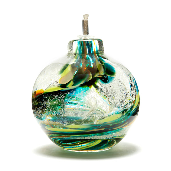 Round memorial glass art eternal flame oil lamp with cremation ash. Teal blue, yellow, and green glass. Colour combination is called "Summer."
